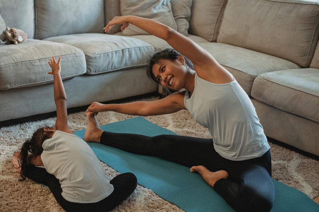 A mother and daughter exercising together