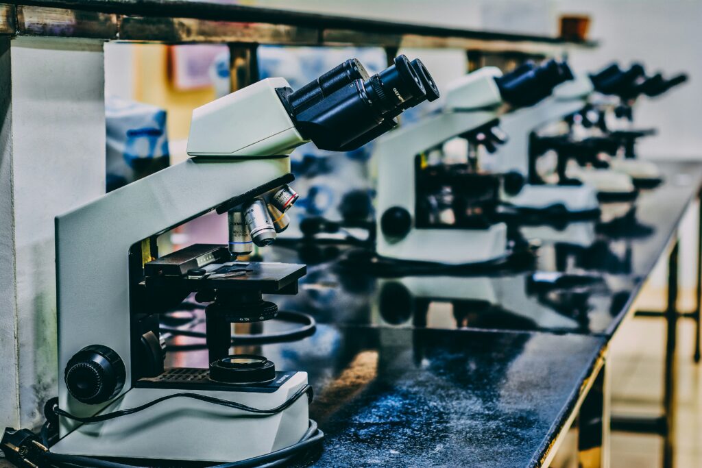 A row of microscopes like those used to research biomarkers for pediatric cancer