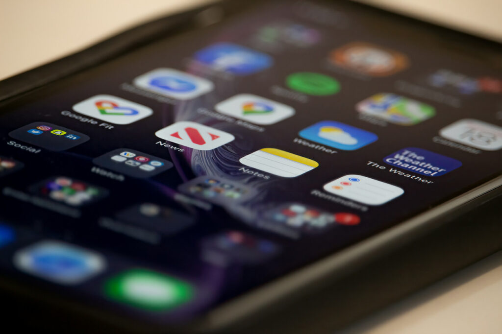 Close-up of a smartphone screen showing app icons